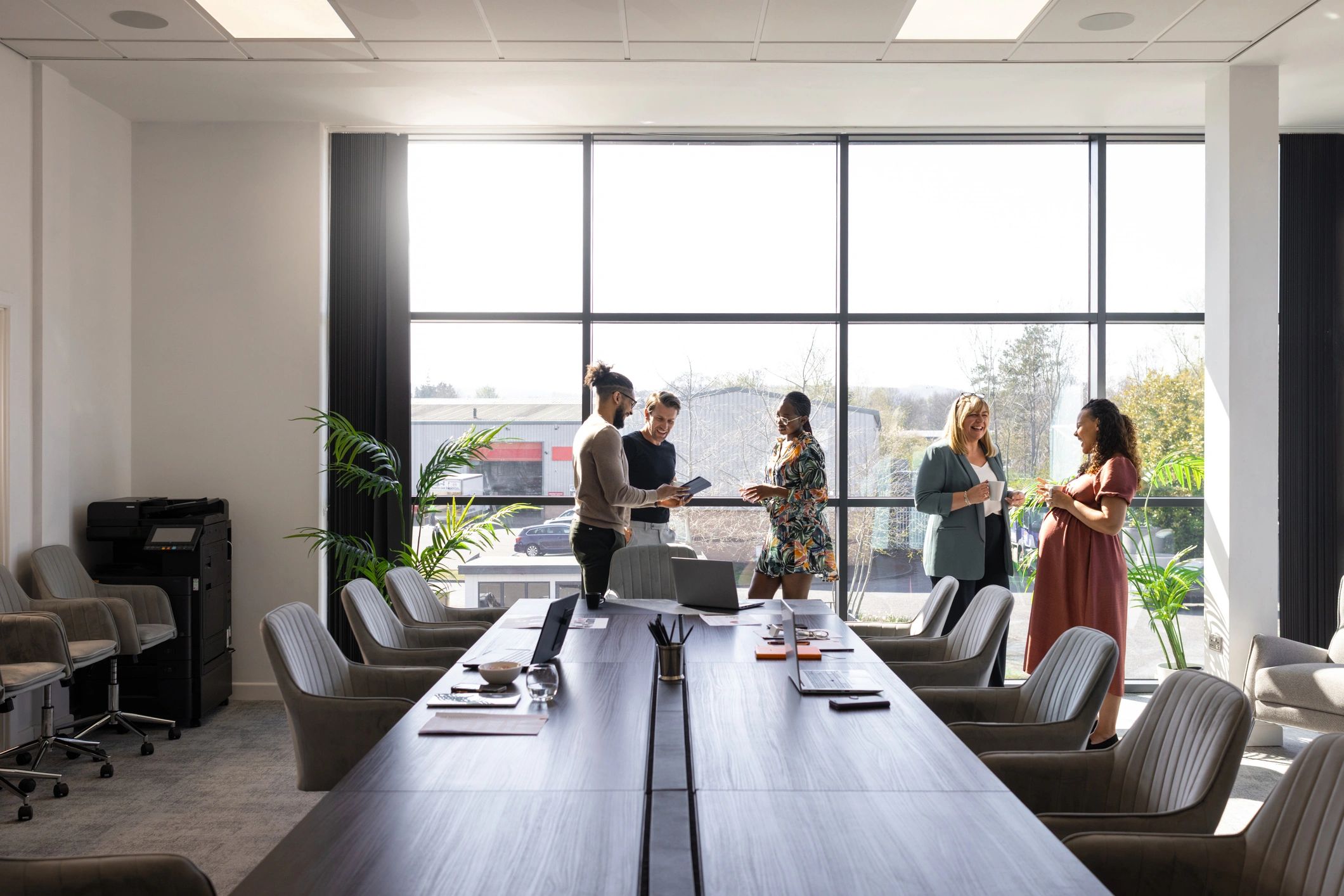 Healthcare leadership team meeting in a modern conference room